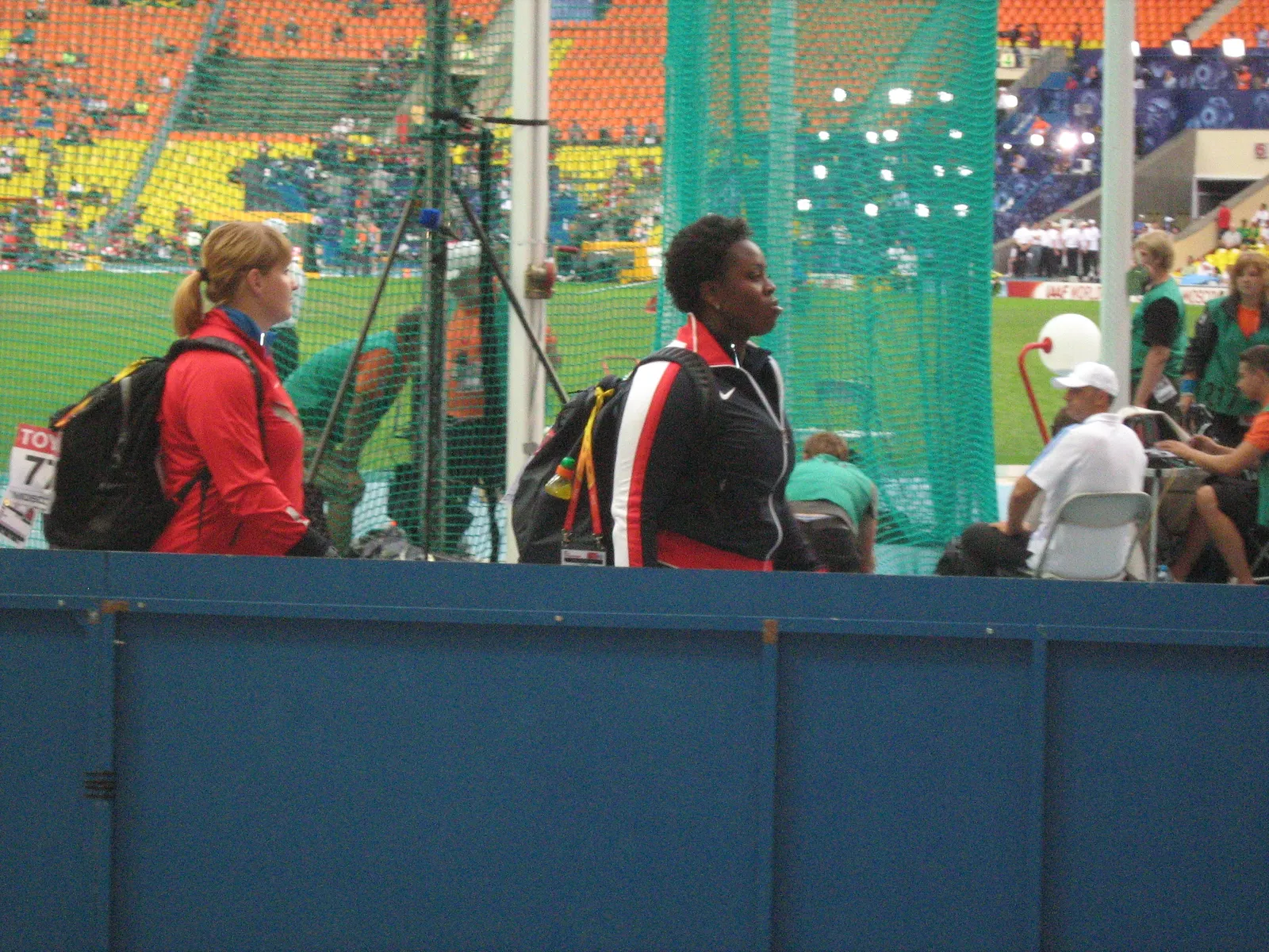 Michelle Carter, in USA team kit, walking past the throwing cage at the 2013 World Championships in Athletics in Moscow, Russia.