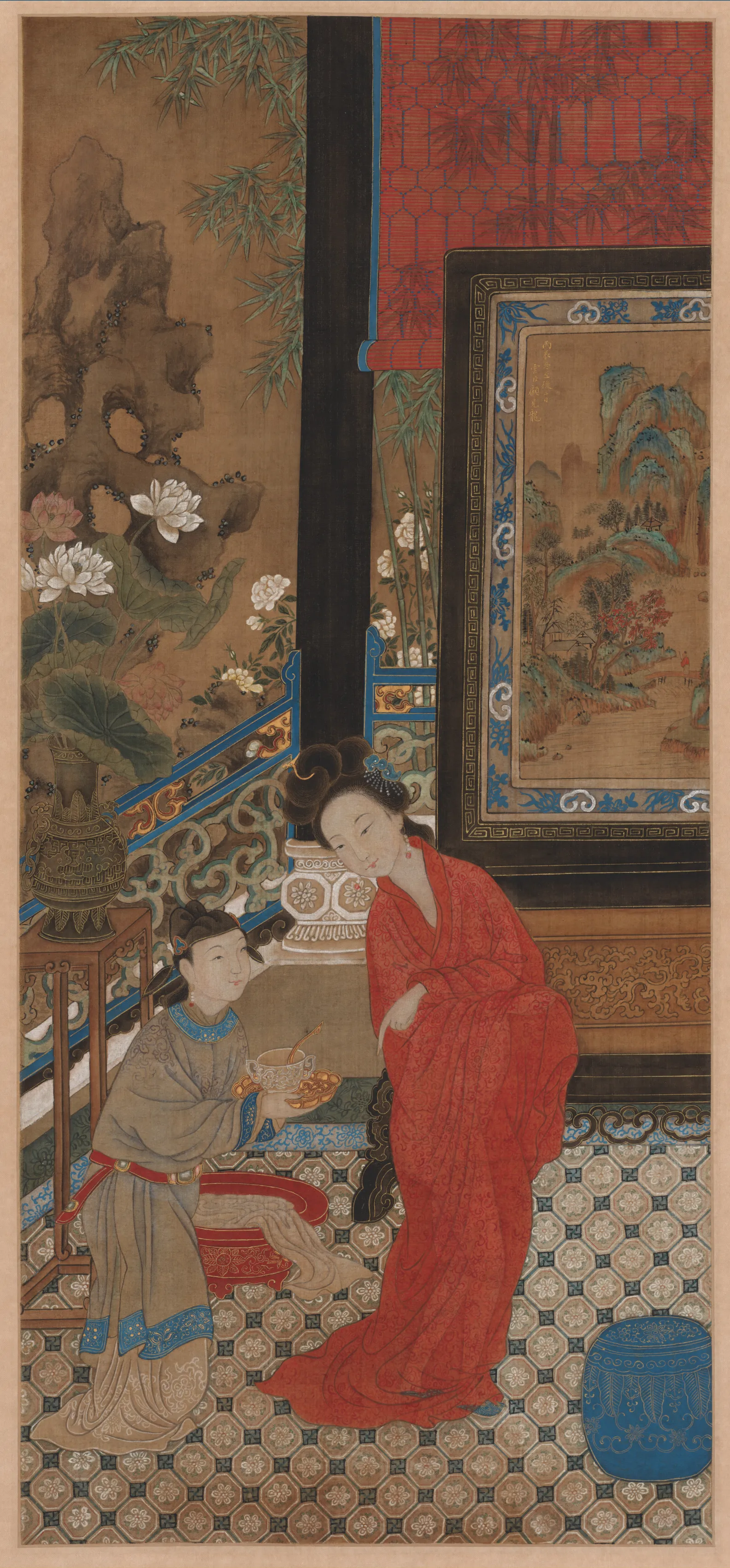 A Chinese hanging scroll in ink, colour and gold on silk showing Yang Guifei after her bath, painted centuries after her lifetime. She leans against a large lacquer screen in a loose vermilion robe, hair pinned in a high double knot, while a kneeling attendant in grey offers her a covered bowl. Lotus flowers, bamboo and a balustrade fill the garden behind them.